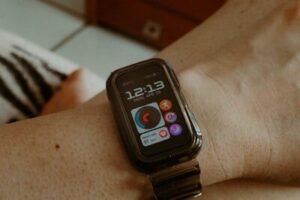 Smartwatch on a person's wrist showing time and icons