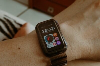 Smartwatch on a person's wrist showing time and icons