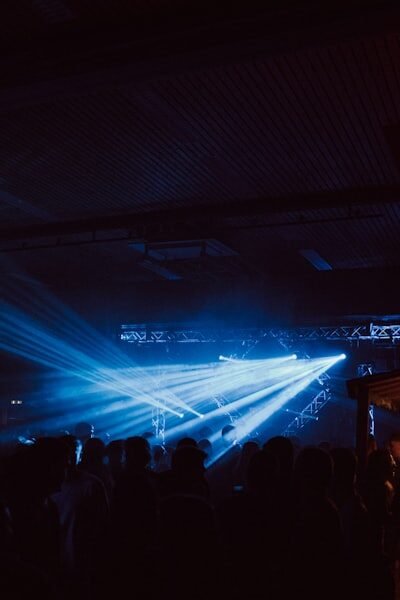 a group of people standing around a stage